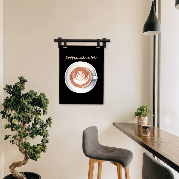 Framed artwork of a coffee cup with latte art on a wall in a modern interior setting.