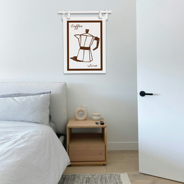 Bedroom with a wooden nightstand, decorative items, and a framed coffee-themed artwork on the wall.