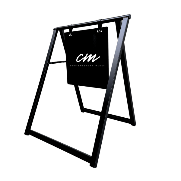 Black metal a-frame sign with 'cm' logo on a white background