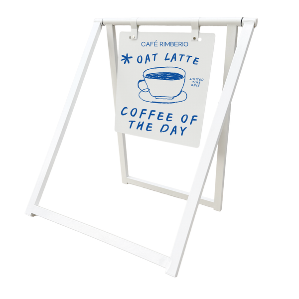 A-frame sign with 'Café Rimberio' branding and text about 'Oat Latte' and 'Coffee of the Day'