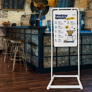 Modern Swing Sign with weekday coffee special in white frame with white board