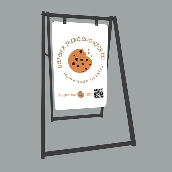 A-frame sign with cookie-themed branding on a gray background