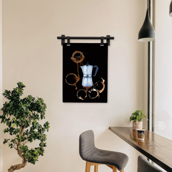 Modern interior with a coffee-themed wall art piece, plant, and chair.