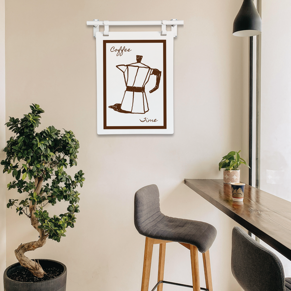 Modern kitchen with a wall-mounted coffee maker print, potted plant, and bar stools.