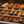 Pastry Display case with various pastries and counter display signs showing their names in a bakery.