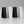 Four table number signs in 2 black and 2 white arranged in a row on a gray background