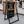 Outdoor sign for Tree Coffee with coffee cup graphic and hours displayed.