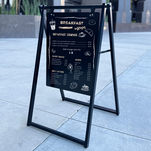 Outdoor breakfast menu sign on a sidewalk
