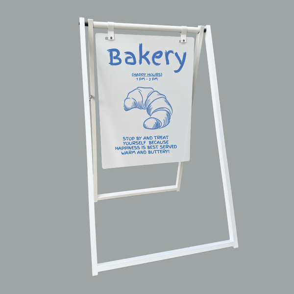 Bakery sign with a white background and blue text on a gray background