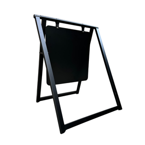 A black metal A-frame sign with a white acrylic board displaying text, set against a white background.