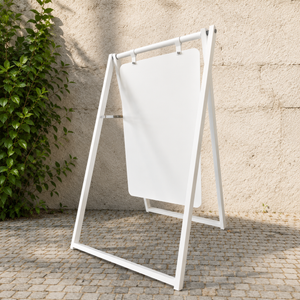 Plain white large metal a frame against a stone wall.