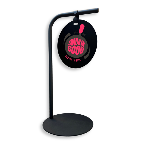 Black minimalist business stand with circular sign featuring 'Smokin' Good' logo 