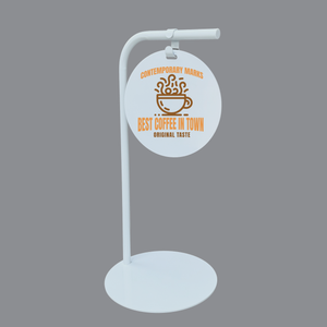 White round stand with circular sign featuring coffee-themed text on a gray background