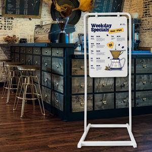 Modern Swing Sign with weekday coffee special in white frame with white board