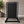Black metal swing stand with a black board in 32