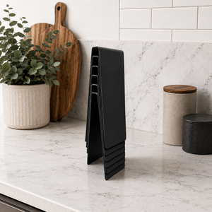Black stackable table number signs on a marble countertop