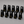 Set of black table number stands with numbers 1 to 10 and 'Owl Cafe' logo on a gray background