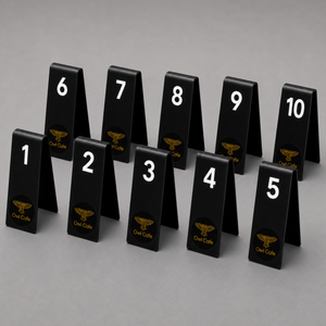 Set of black table number stands with numbers 1 to 10 and 'Owl Cafe' logo on a gray background