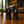 Two black number stands on a wooden table with a coffee shop background
