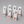 Set of six white table number sign with number 1-6 and red custom logos on a gray background