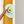 A white half round sign featuring a smiling avocado graphic and the text 'AVOCADO ORGANIC CO.' against a mustard yellow door, with a light gray wall on the right.