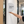 A white semi-circular wall sign reading 'Meeting Room' on a white office hallway door.