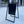 Black a-frame sign on a sidewalk with a building in the background