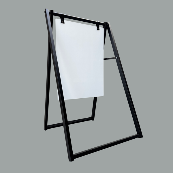 Black metal a-frame sign holder with a white board on a gray background