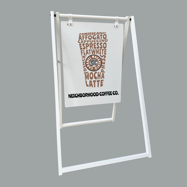 A-frame sign with coffee-themed text on a gray background