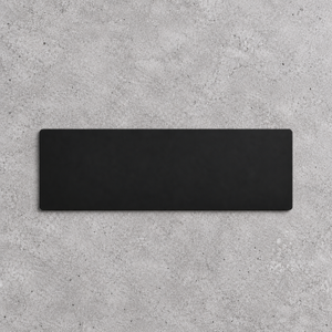 A minimalist front black rectangular blade sign displayed flat against a textured gray concrete background.