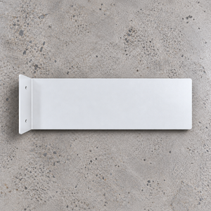 A back view minimalist white rectangular wall mount blade with a left-side flange and two screw holes, shown from a top-down perspective on a textured gray concrete surface.