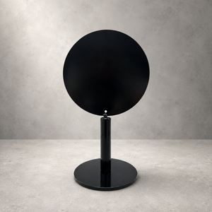 A modern black round table sign