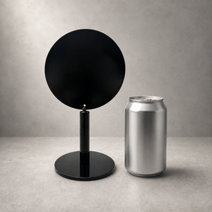 A minimalist black circular table sign shown next to a silver aluminum beverage in 12 oz  for a size reference.