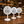 Three round white table numbers signs in 01, 02, and 03 sequence, printed with 'AURORA CAFE TABLE' and a coffee cup icon, displayed on a wooden table in a cafe setting.