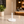 A minimalist white round tabletop side in a perfect sideview..