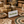 Handmade crafts including soaps, jewelry, and a crochet item on a wooden surface with a 'Handmade' retail sign.