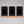 Three black rectangular metal display boards with silver magnets, each resting on a light wood stand, arranged side by side.  
