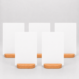 Five blank white vertical table menu display on small rounded wooden stands