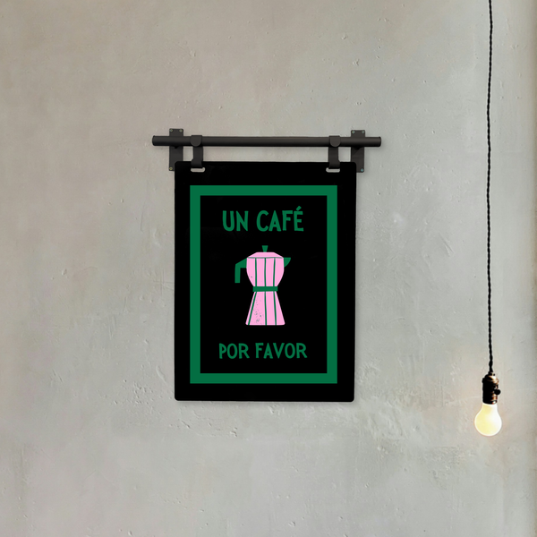 UN CAFE coffee sign with text and coffee machine illustration on a wall.